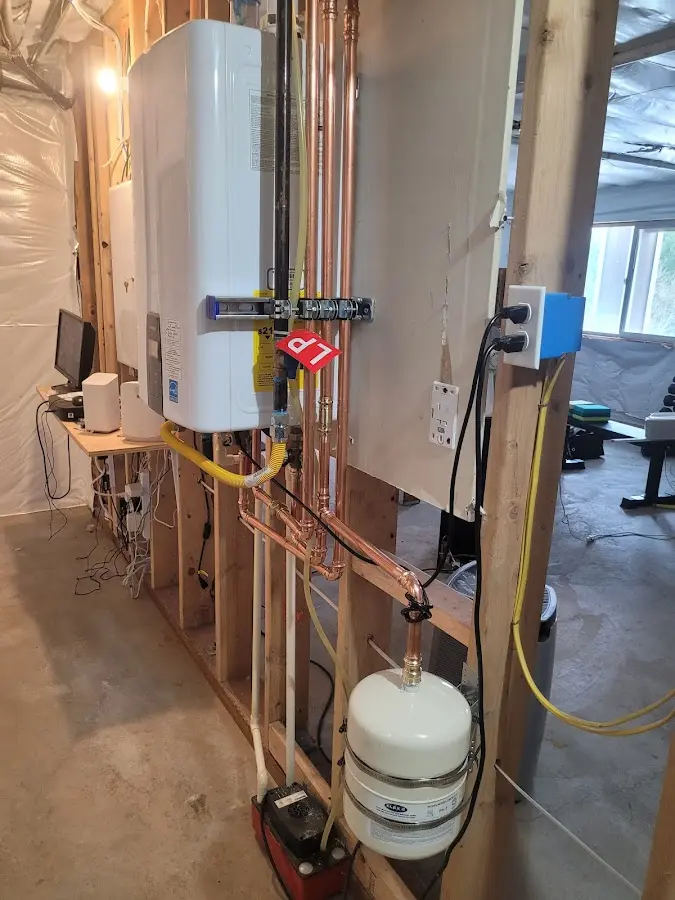 Licensed plumber repairing a kitchen sink in Watertown